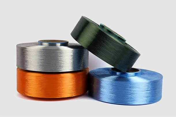 ポリエステル FDY 糸の低収縮特性は繊維およびアパレル業界にどのような影響を与えるか